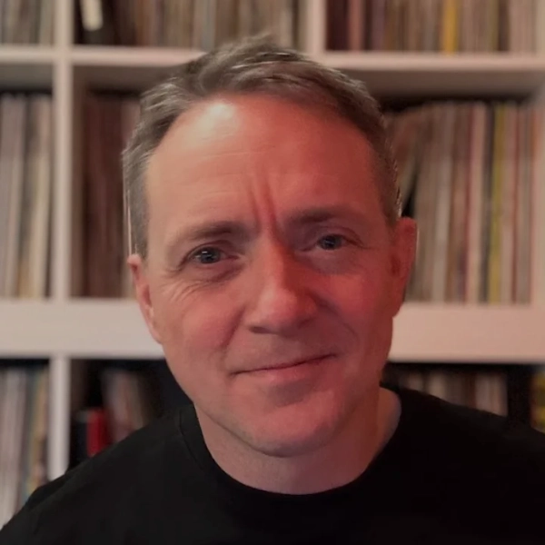 Jay Nichol in front of his record collection